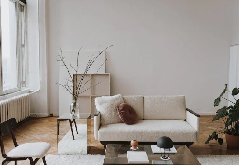 Aesthetic stock image showing a living room with a comfortable couch. The image is purely for decorative us only to support the blog post on 51 ambitious goals to help you break free of your comfort zone