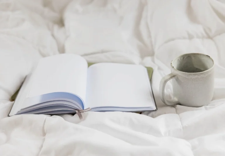 The featured image of the blog post shows an open blank journal on a bed, awaiting endless possibility.