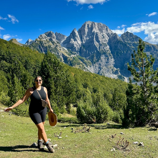 Recent picture of Thalia, author of Notes by Thalia taken in September 2024 posing in front of a mountain in Northern Albania
