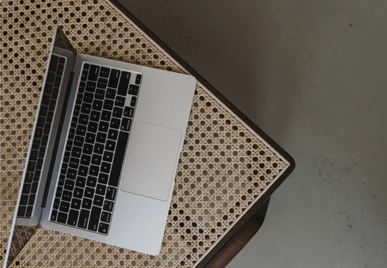 Aesthetic stock image showing an open laptop on a table. The image is purely for decorative us only to support the blog post on how to deal with a toxic work environment.